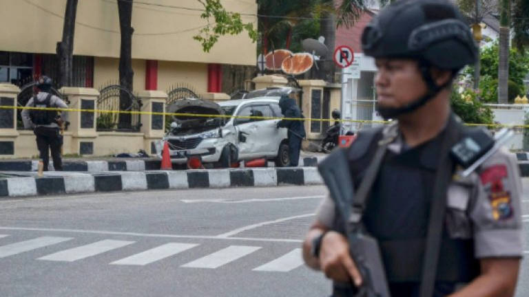 Indonesia passes tougher terror law after suicide attacks