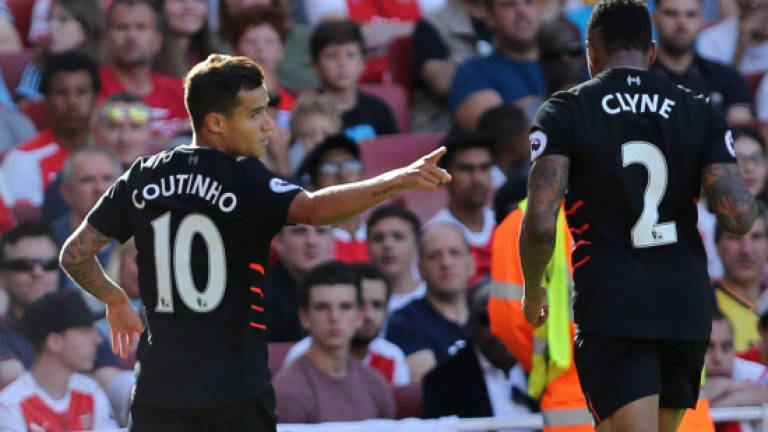 Coutinho fires Liverpool to thrilling Arsenal win
