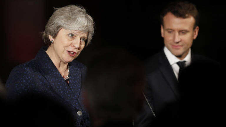 May, Macron strike border security deal at UK summit