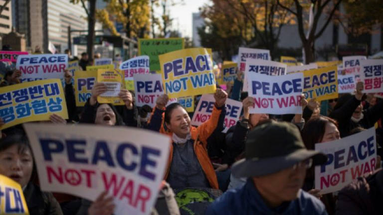 Hundreds urge peace in anti-Trump protest in S. Korea