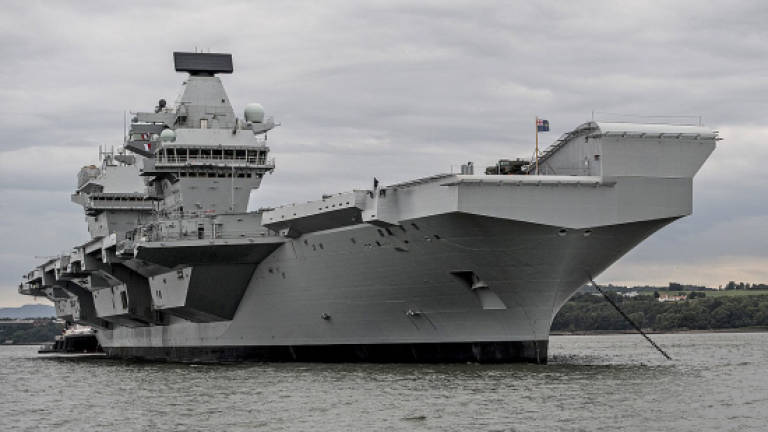 Queen inaugurates new 'best of British' aircraft carrier