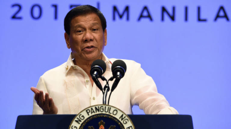 Philippines' Duterte gives China free pass over sea row