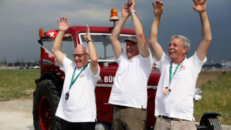 Three Switzerland fans drive 1,800 km in tractor to reach World Cup
