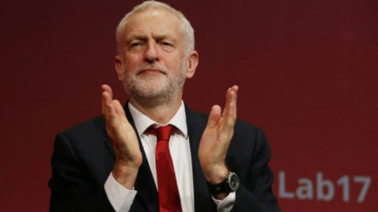UK's triumphant Corbyn eyes path to power at Labour conference