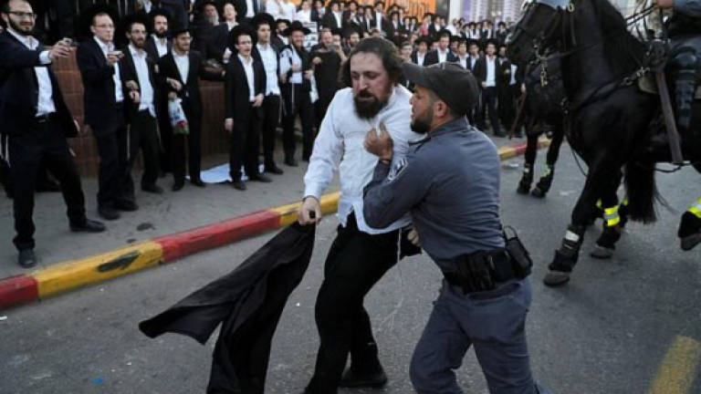 Israeli police arrest 33 in ultra-Orthodox draft riots