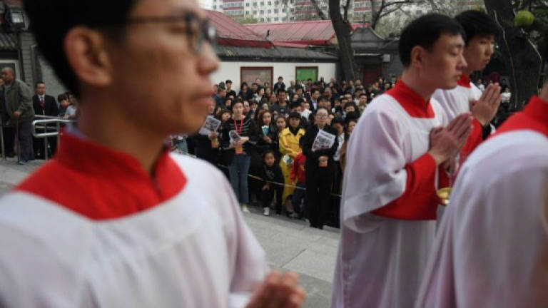 China denies detaining underground bishop