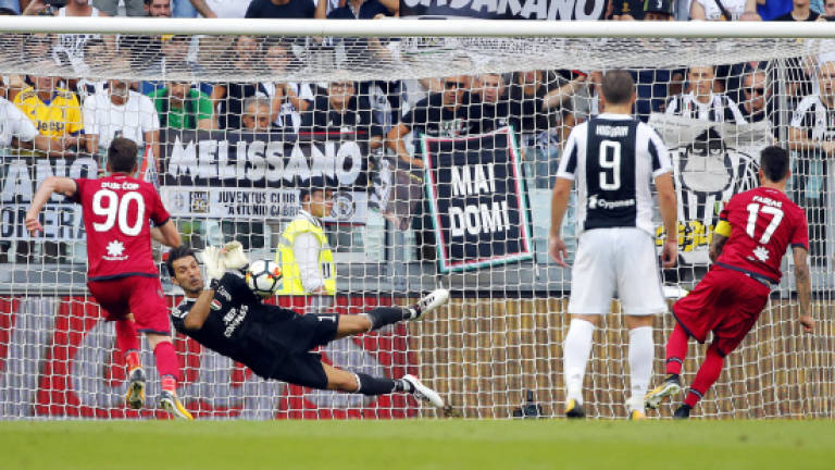 Buffon saves VAR penalty as Juve overrun Cagliari