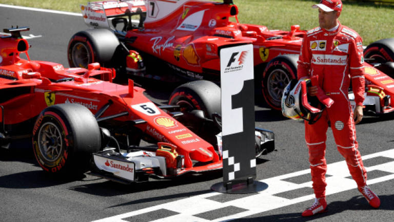 Vettel delights in proving Ferrari critics wrong
