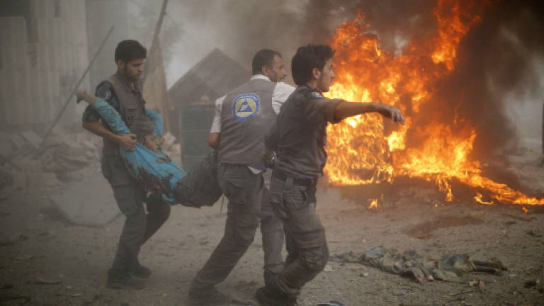 Syria strikes toll nears 100, UN aid chief 'horrified'