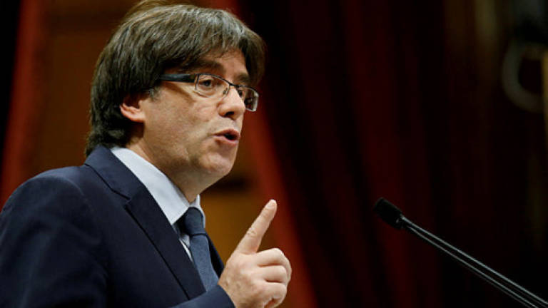 Catalonia's axed leader 'in Brussels'