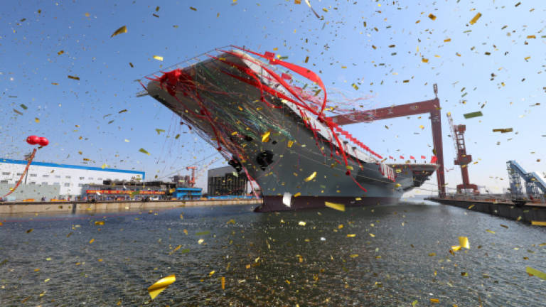 China launches first domestically built aircraft carrier: media