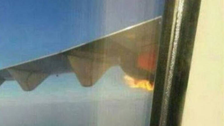 Malindo Air plane turns back after engine catches fire