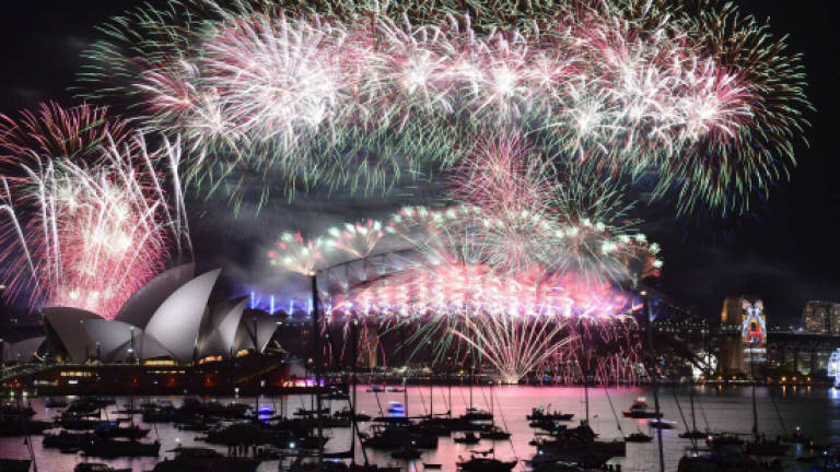 Australia kicks off global New Year party defying terror threat