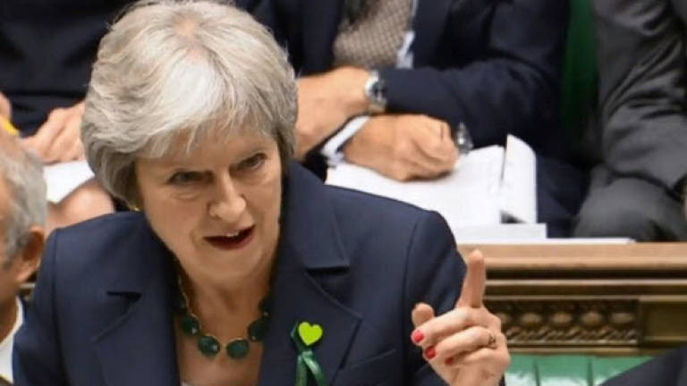 May back in the breach as Brexit battles resume