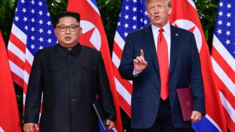 China urges 'full denuclearisation' as Kim-Trump meet