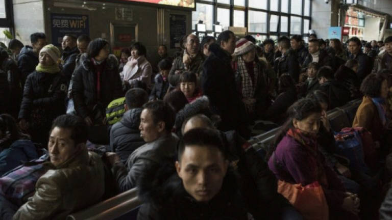 Millions of Chinese leave for Lunar holidays, but many may not return