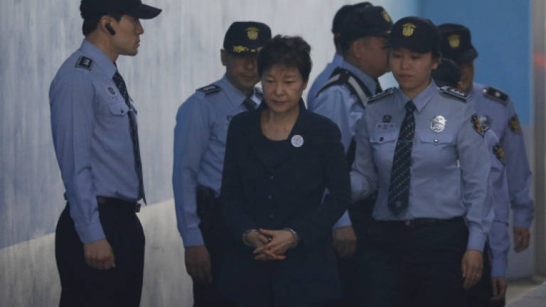Ousted S. Korean leader Park goes on trial