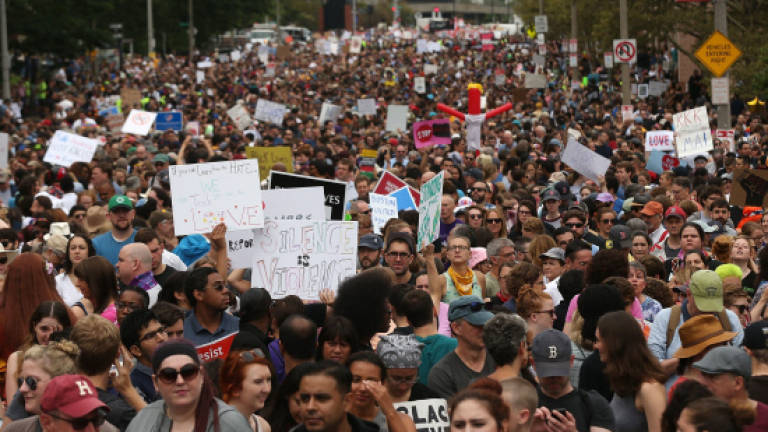 Thousands join anti-racism march in Boston