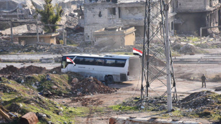 Buses enter rebel Aleppo to resume evacuations