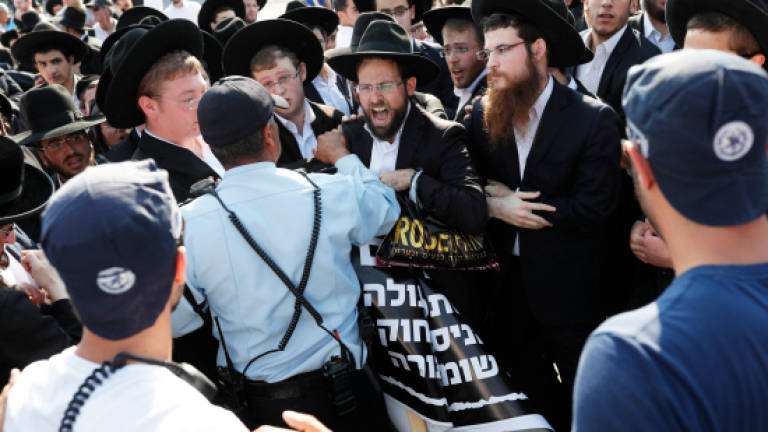 Protest by hardline religious Jews shuts entrance to Jerusalem