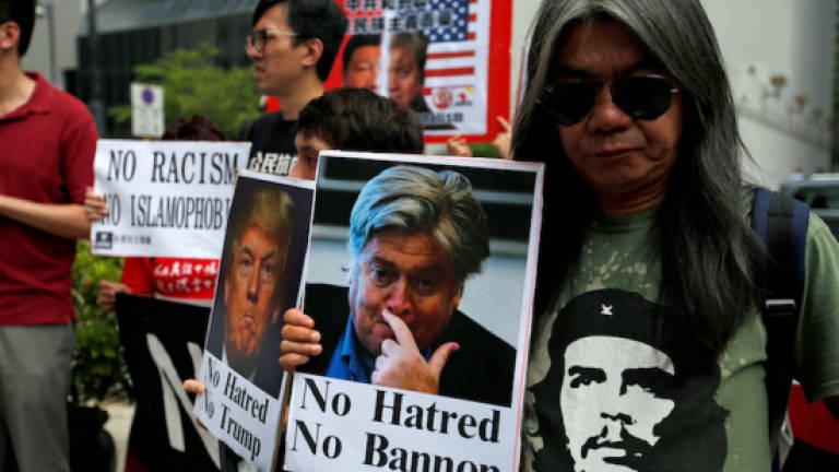 Anti-racism protesters greet ex-Trump aide Bannon in Hong Kong