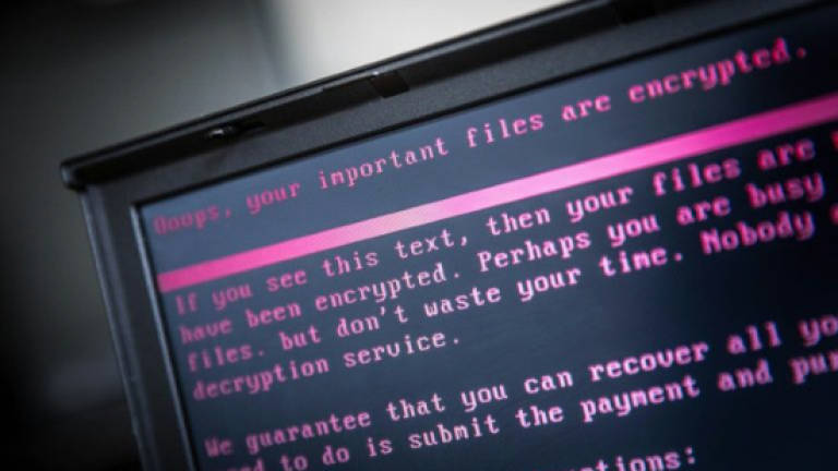 Firms scramble to recover from wave of cyberattacks