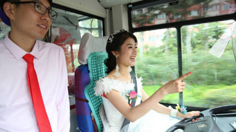 Bride drives groom to wedding in bus