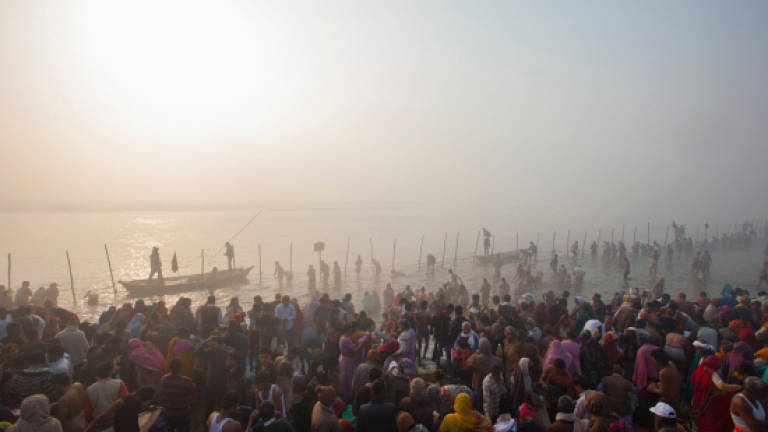 Millions gather to 'purify souls' in Hindu bathing ritual