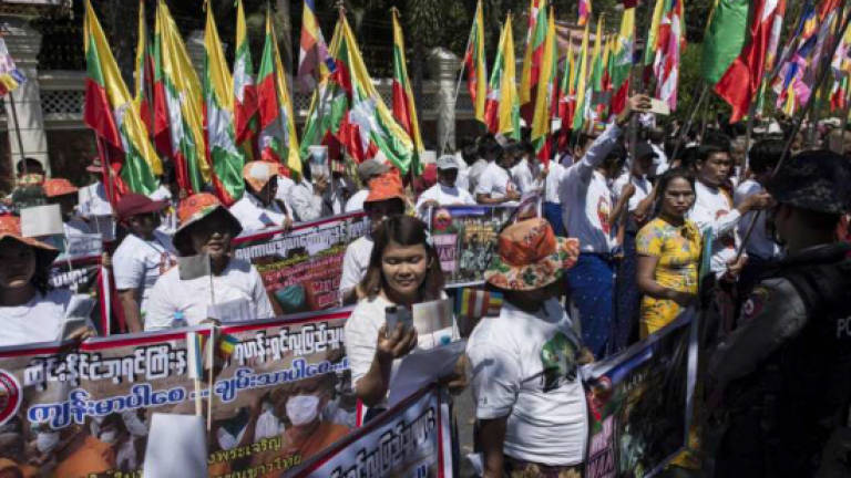 Myanmar Buddhists protest raid on scandal-hit Thai temple