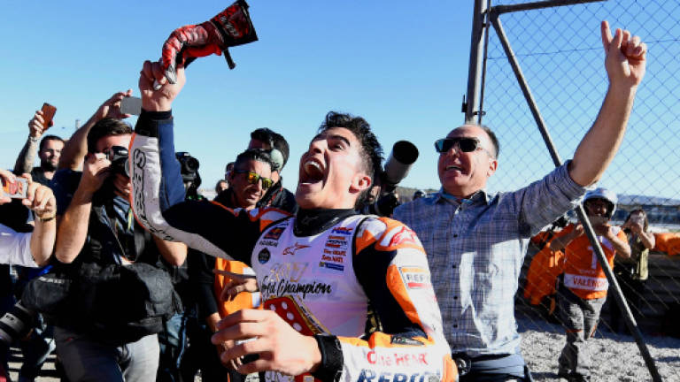 Marquez wins fourth MotoGP world title