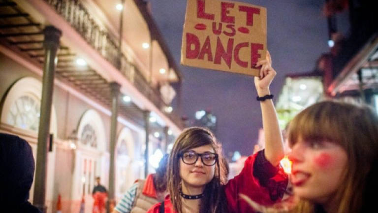 Strippers march in New Orleans to protest club closures
