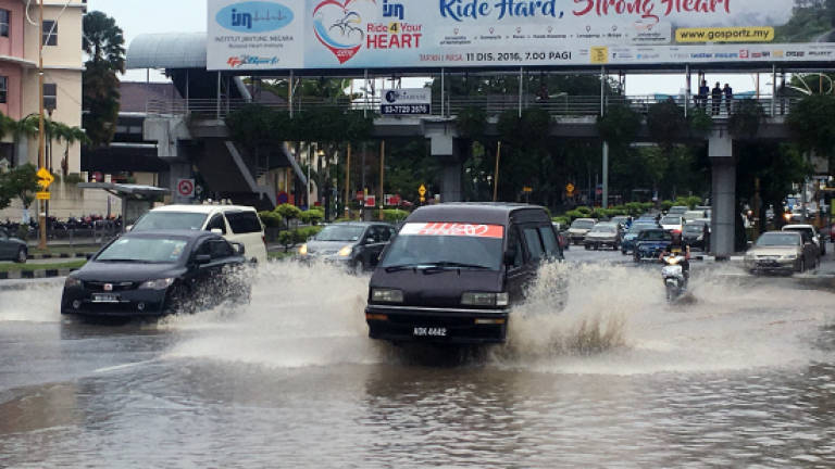 Downpour causes flash floods in KL