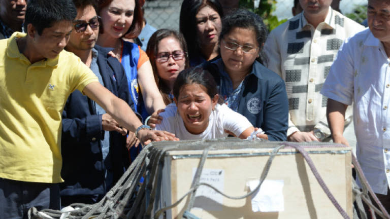 Murder shocks Filipinas in Kuwait, but some vow to stay