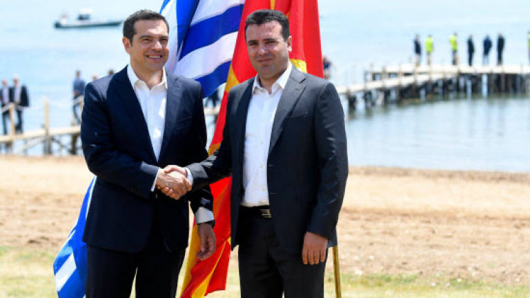 Greece, Macedonia sign historic deal to end name row