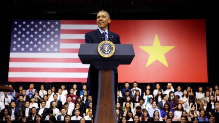 Young Vietnamese quiz Obama on rap, weed and good looks