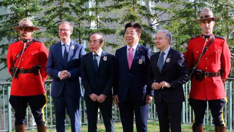 Joined by Royal Canadian Mounted Police officers, Canada’s Central Bank Governor Tiff Macklem (2nd L) and Finance Minister Francois-Philippe Champagne (2nd R) greet Japan’s Central Bank Governor Kazuo Ueda (3rd L) and Finance Minister Katsunobu Kato at the opening for the G7 Finance Ministers and Central Bank Governors’ Meeting in Banff, Alberta, Canada on May 21, 2025. AFPpix