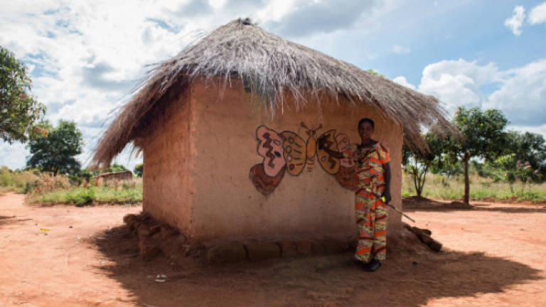 Painted huts offer DR Congo village a tourism lifeline