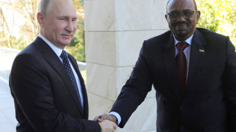 In Russia, Sudan's Bashir asks Putin for 'protection' from US