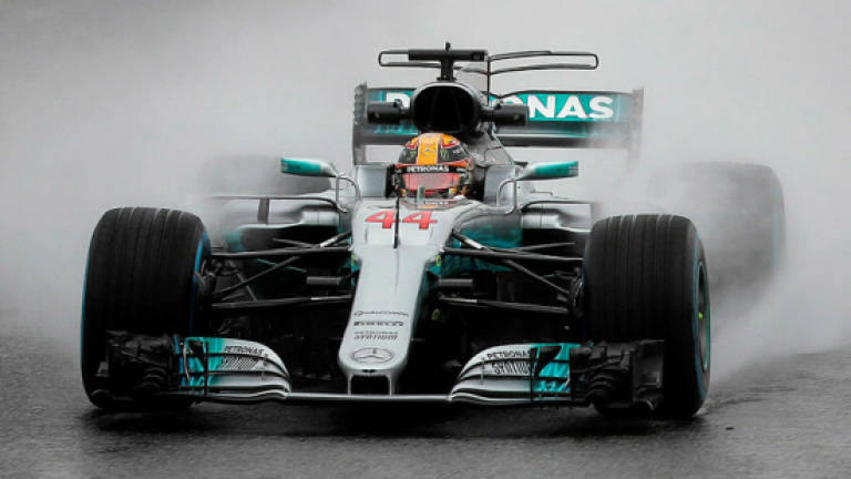 Hamilton romps to pole in Japan