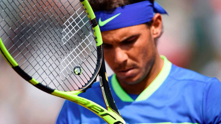 Nadal, Djokovic march on as Muguruza survives