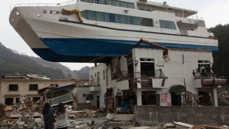 Japan disaster minister resigns over quake gaffe