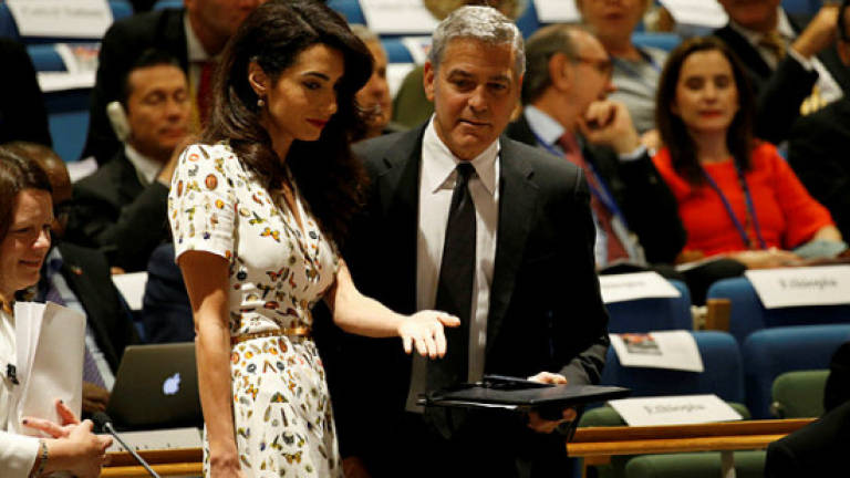 Clooney to defend Reuters journalists held in Myanmar