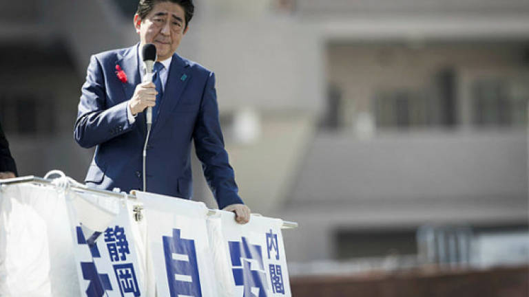 Abe nears two-thirds majority in Japan election: Polls