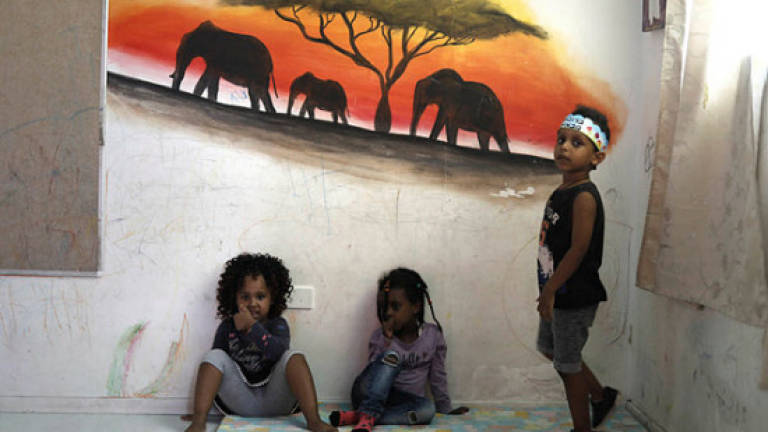 Unwelcome in Israel, African refugees dream of home