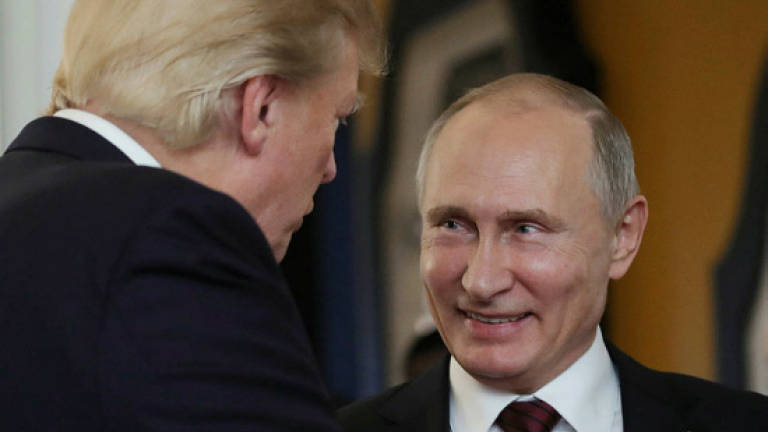 Trump says Putin 'means it' with election meddling denials (Updated)