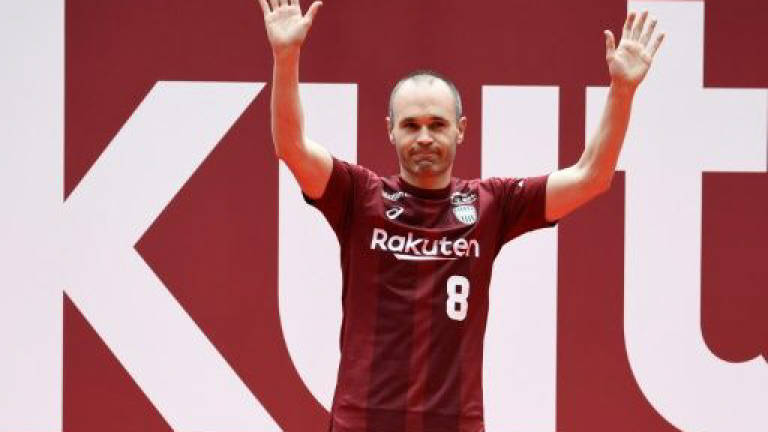 Iniesta greets Japanese football fans, vows to conquer Asia
