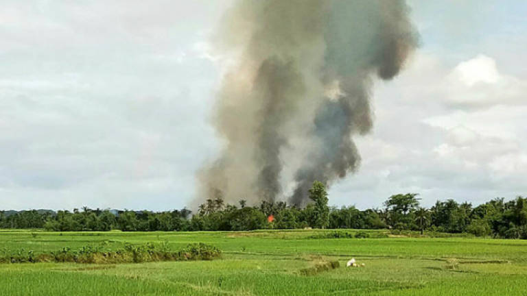 Myanmar army investigating mass grave in Rakhine