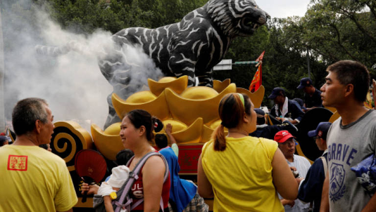 Thousands protest call to curb incense burning in Taiwan