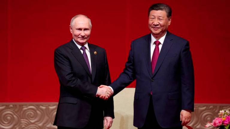 Russian President Vladimir Putin and Chinese President Xi Jinping attend the gala event celebrating 75th anniversary of China-Russia relations in Beijing, China May 16, 2024. - REUTERSPIX