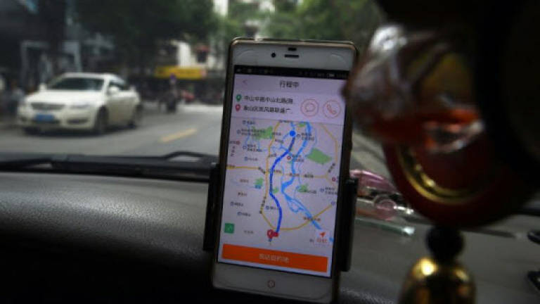 China's Didi steps up challenge to Uber with Australia push